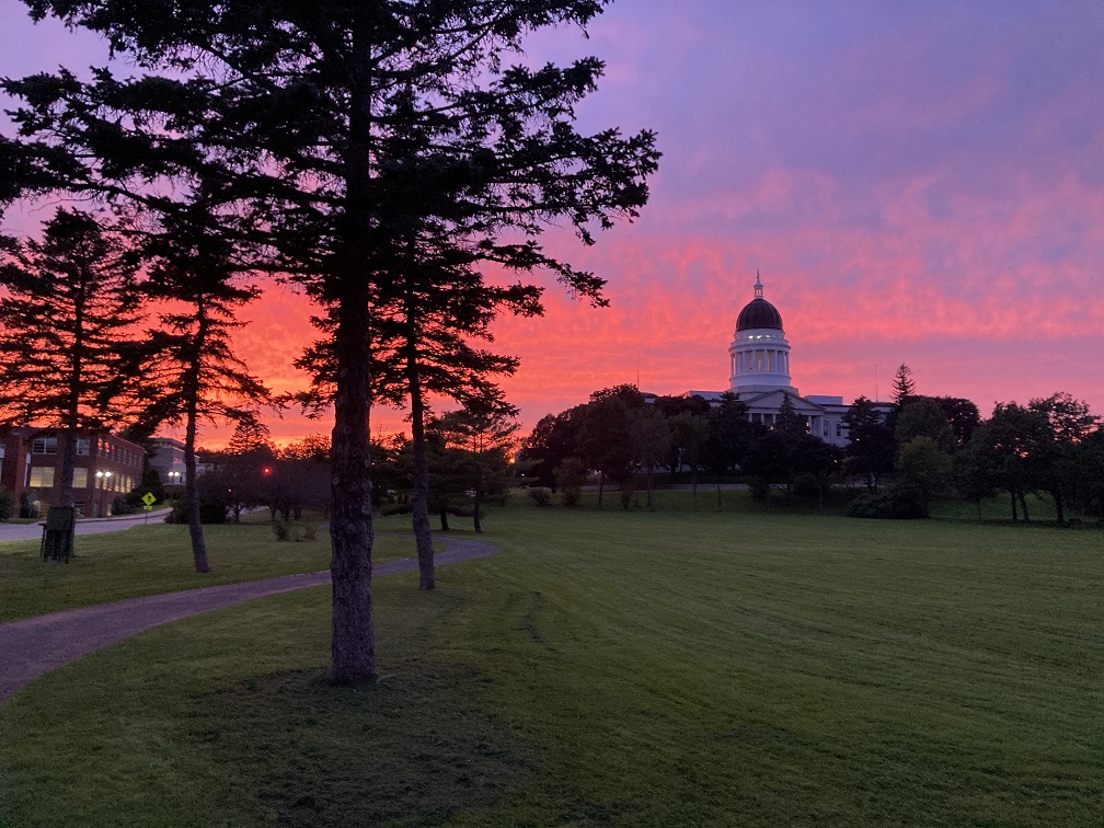 Maine State Capitol Building as sun sets on a summer evening.