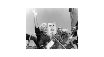 Margaret Chase Smith waving from car.