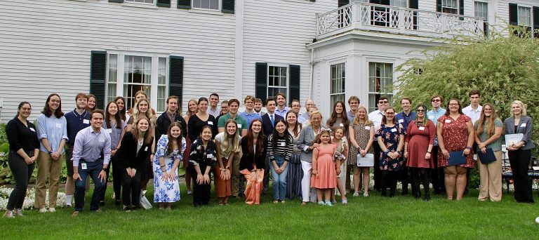 2023 Maine Government Summer Internship Program graduates standing in the backyard of the Maine Governor's Mansion also known as the Blaine House.