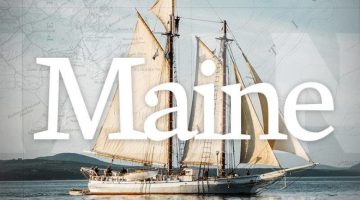 Text reading Maine with backdrop of a sailboat.
