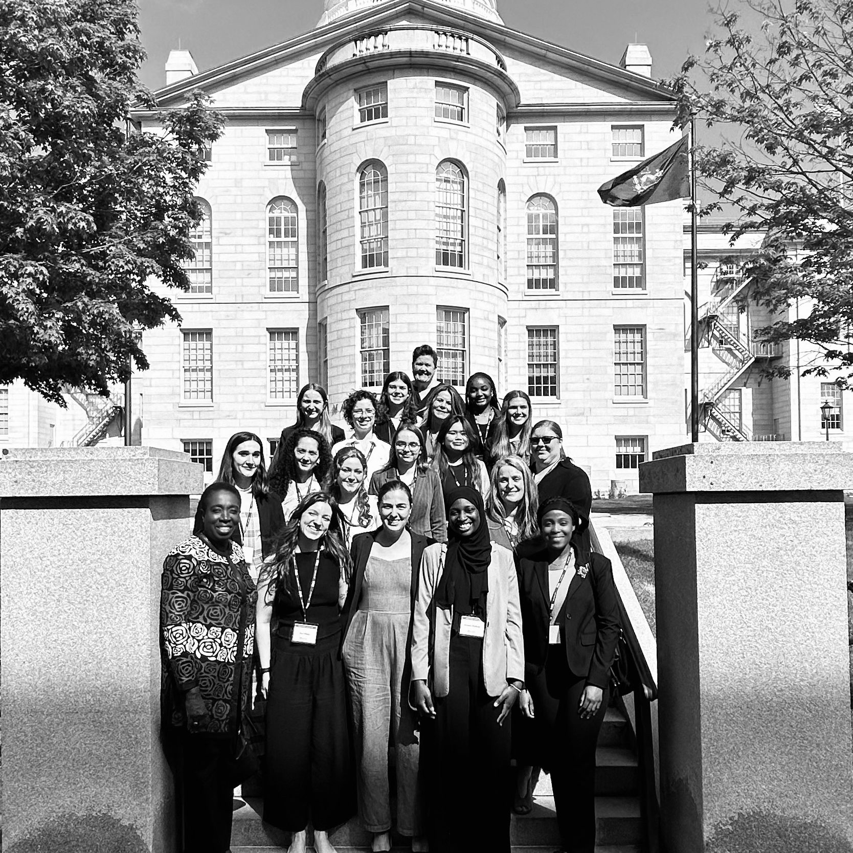 2024 NEW Leadership participants standing outside and in front of the State Capital in Augusta, Maine